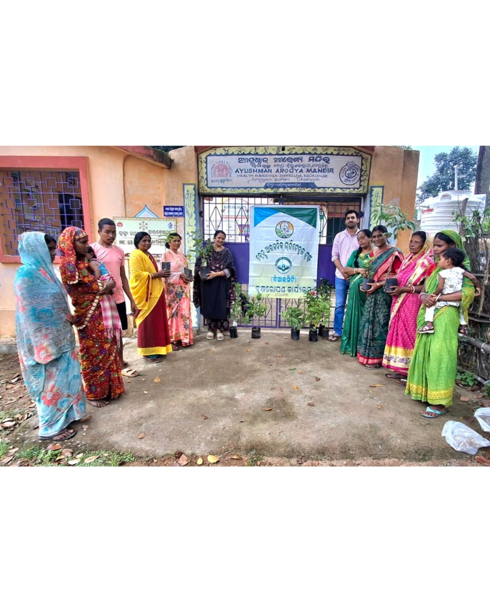 Brains Iconic Charitable Trust volunteers at a tree plantation drive outside the Ayushman Arogya Mandir Health Sub-Centre, Jharbeda, Keonjhar district.